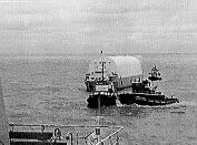 Tugs and barge